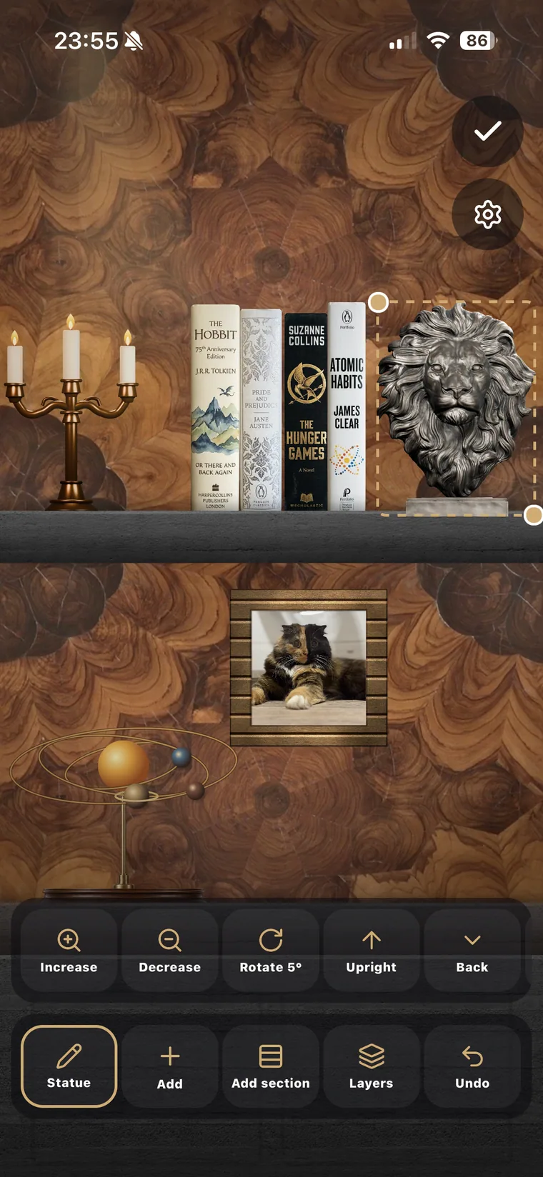 Shelfroom shelf in Edit mode on an iPhone, with books, decor, and editing controls